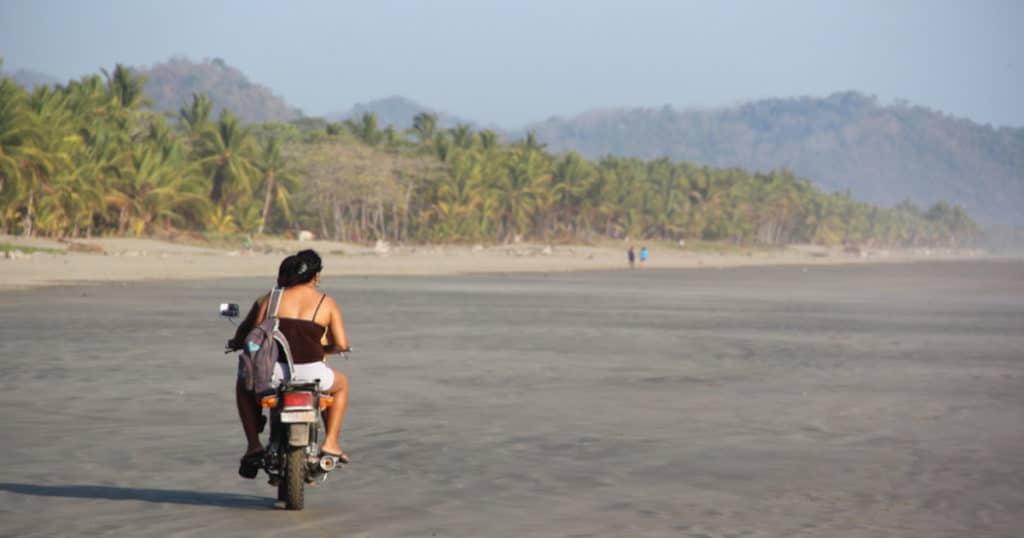 motorbike on the beach in costa rica - sustainable tourism Discova