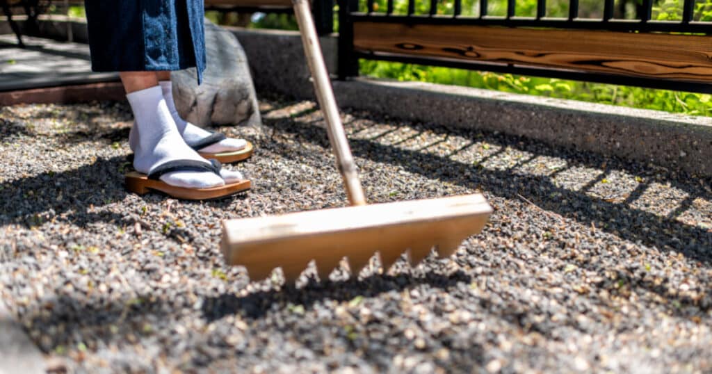 raking a peaceful Japanese zen garden - Japanese secrets to a harmonious life