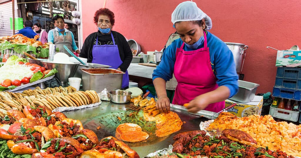 locals preparing traditional mexican dishes that everyone must try