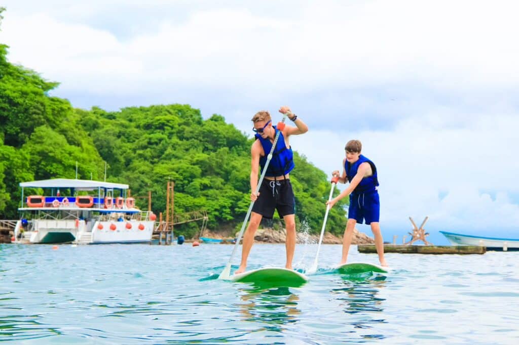 Two men paddleboarding Las Caletas