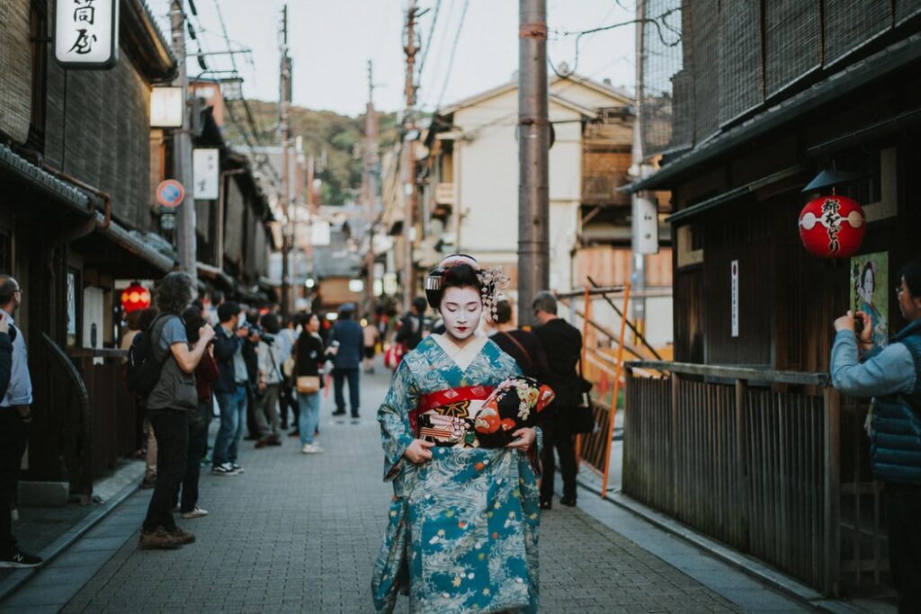 Geisha walking through Kyoto street