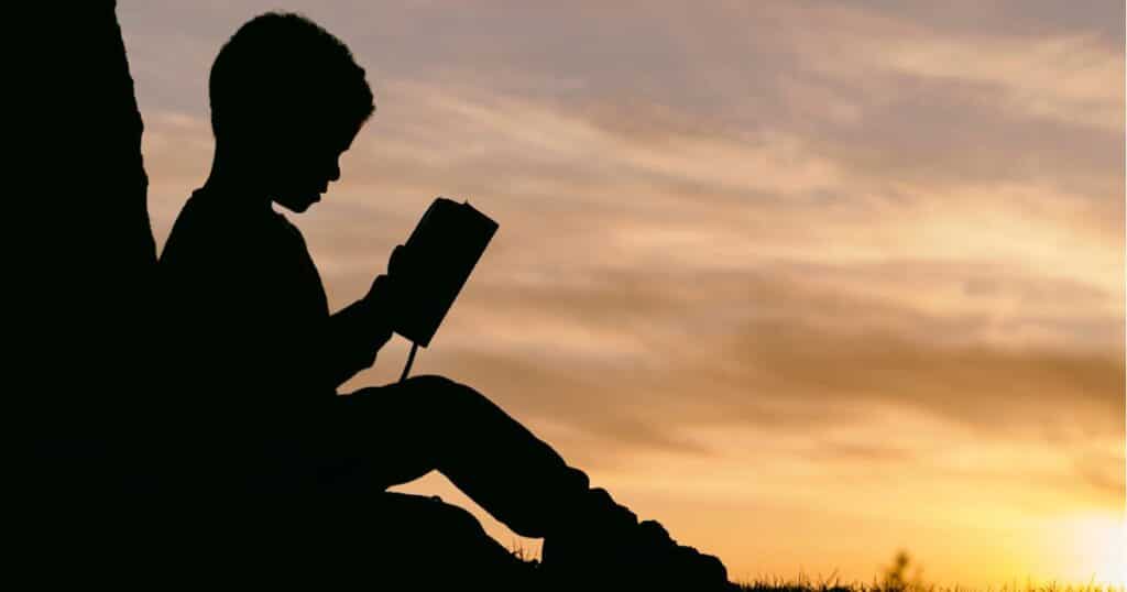 Child reading silhouette