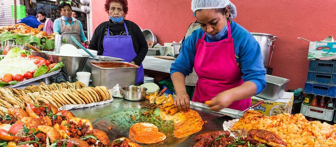 locals preparing traditional mexican dishes that everyone must try